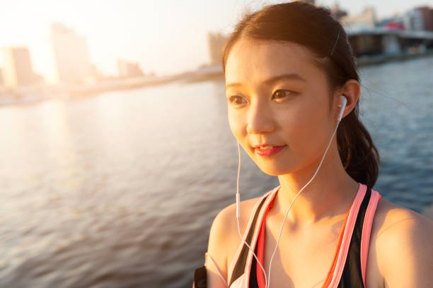 istock Young girl jogging in the park 947710290