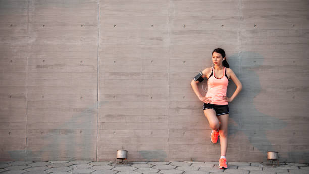 istock Young girl jogging in the park 947710358