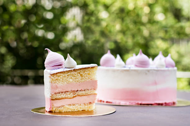 istock Cake decorated with pink meringues.  Cake for a girl 947713220