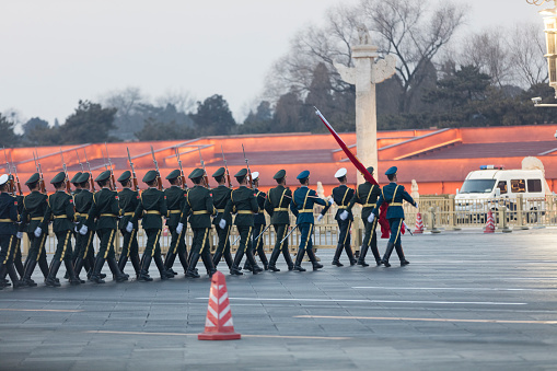 Daily event of he lower the national flag at Tiananmen square of Beijing. A guard of honour of the three services is performed this event everyday.