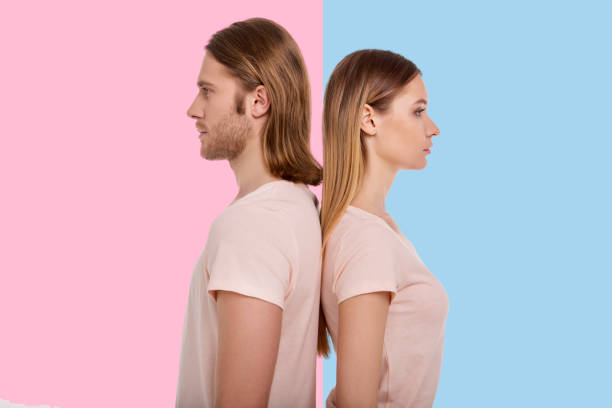 istock Pleasant young couple standing back to back 947714788