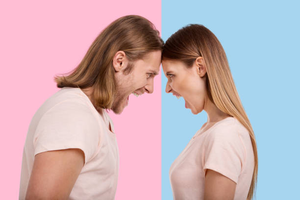 istock Young couple screaming and pressing their foreheads together 947718556