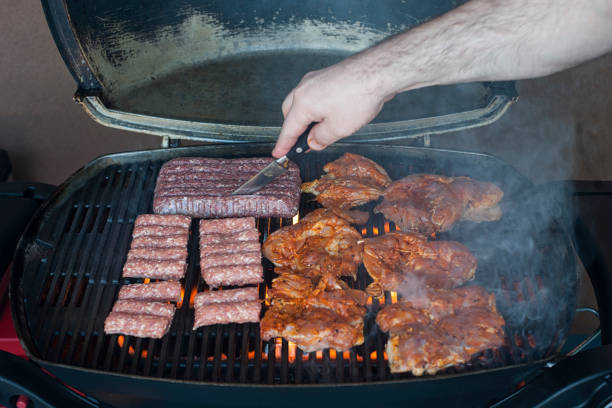 istock Raw meat cooking on the grill 947718744
