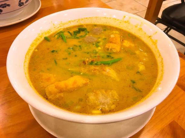Curry ramen with meat seafood and veggies