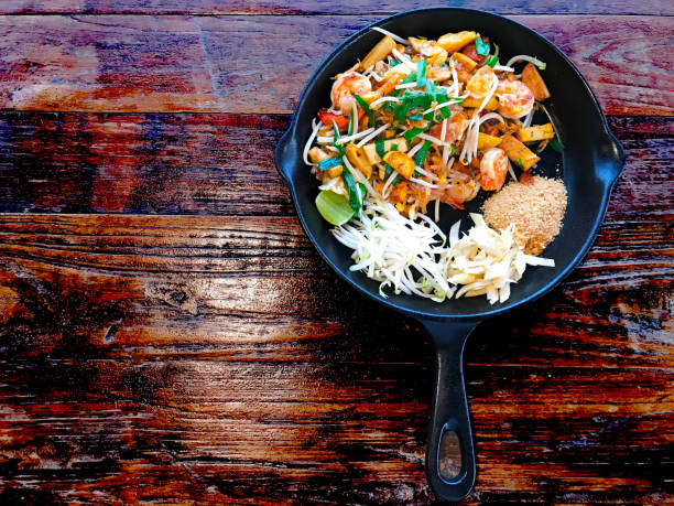istock Pad Thai noodles in pan 947721782