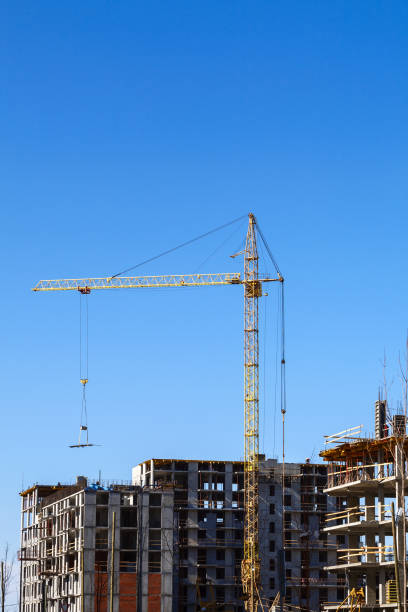 istock construction of a multi-storey building on a blue sky background 947721838