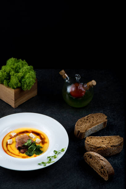istock An appetizing pumpkin soup is served in a white plate in a restaurant 947722050