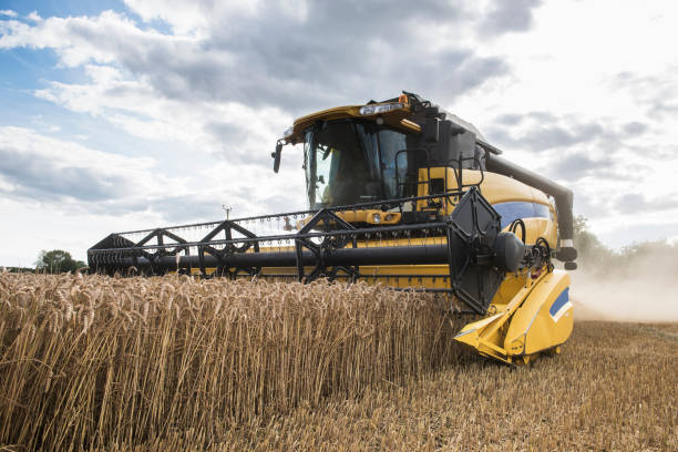 istock combine harvester working in field 947724310