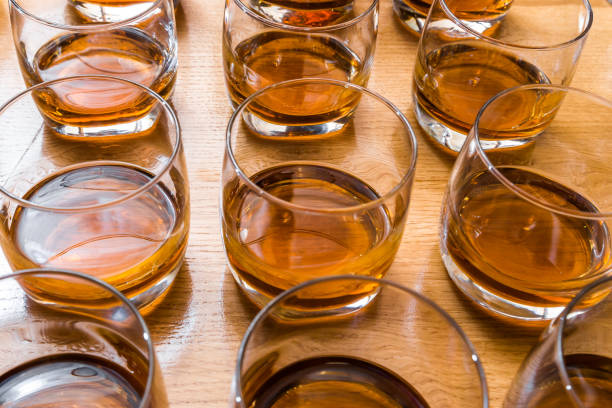 istock Glasses are filled with whiskey on the table 947725702
