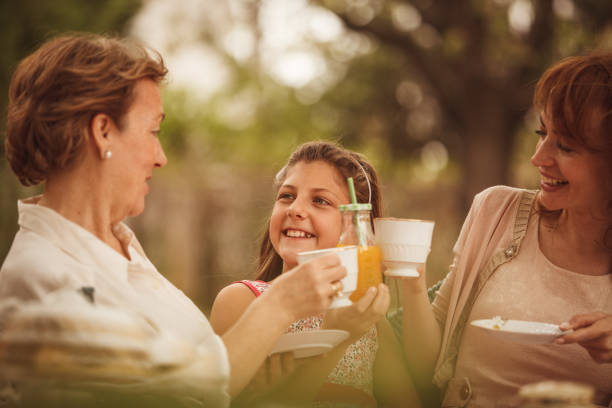 istock Women having a tea party 947725896