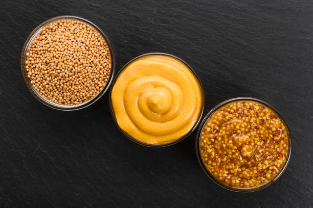 istock Set of different species of mustard on a rustic background 947729726