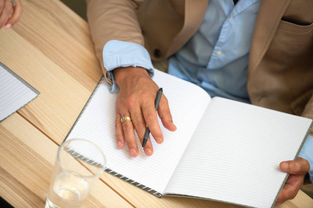istock Australian Businessman Writing 947735226