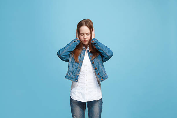 istock Beautiful woman in stress isolated on blue 947742424