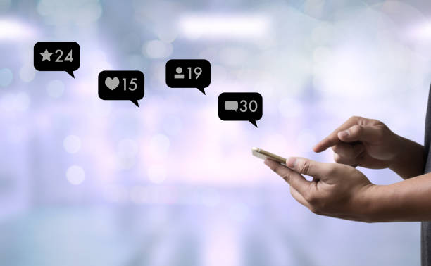 istock Contact us  sms media man use  smart phone social media network pop notification icons 947742608