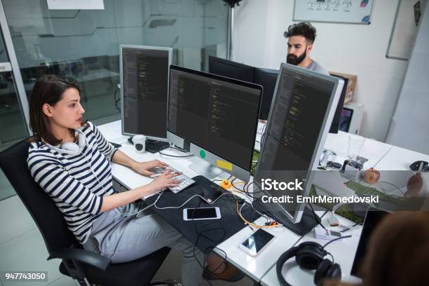 Young Female Computer Programmer Working On Computer Stock Photo - Download Image Now