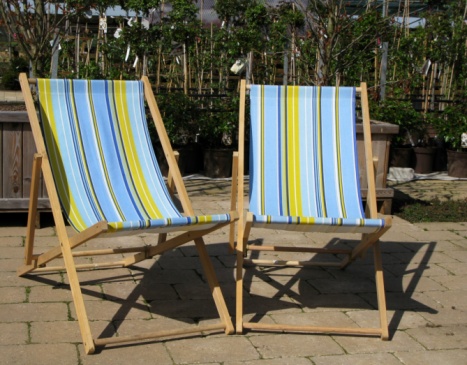 A deckchair on the lawn in the home garden