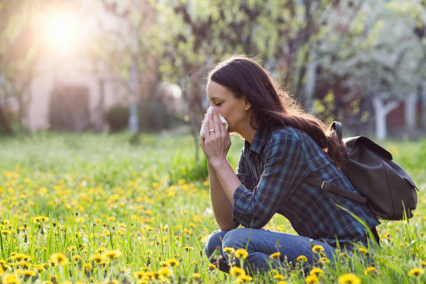 istock Woman having allergy reaction on meadow 947751832