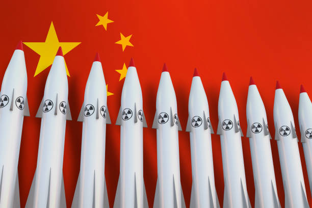 Nuclear missiles in a row and flag of China stock photo