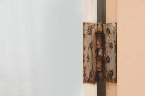 Bathroom door hinge rust.On the door of PVC waterproof and empty space for text. Bathroom door hinge rust.On the door of PVC waterproof and empty space for text. -The concept of using improper equipment soldier on the wall stock pictures, royalty-free photos & images