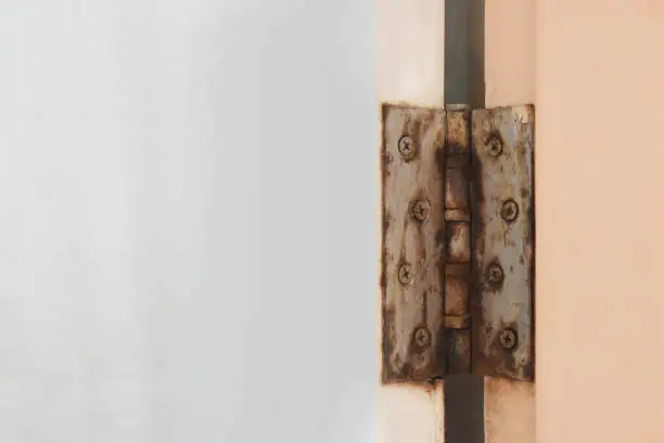 Photo of Bathroom door hinge rust.On the door of PVC waterproof and empty space for text.