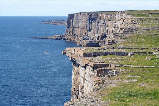 Rocky cliffs along the coast of Inis Mor