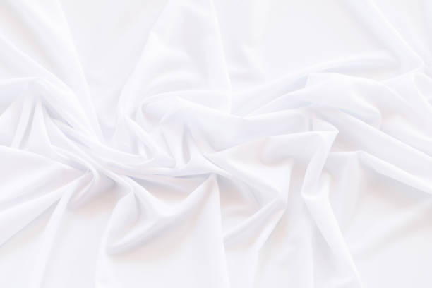 istock White fabric background and texture, Crumpled of white satin for abstract and design 947762512