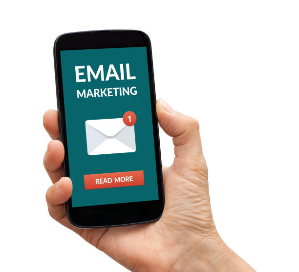 istock Hand holding smart phone with email marketing concept on screen 947763206