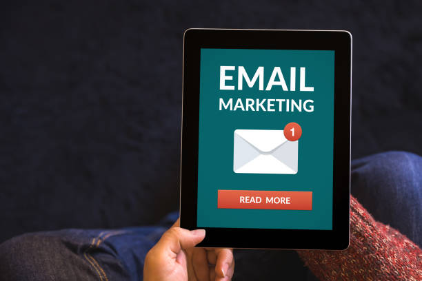 istock Hands holding tablet with email marketing concept on screen 947763240