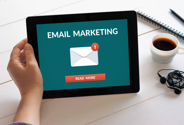 istock Hand holding tablet with email marketing concept on screen 947763266