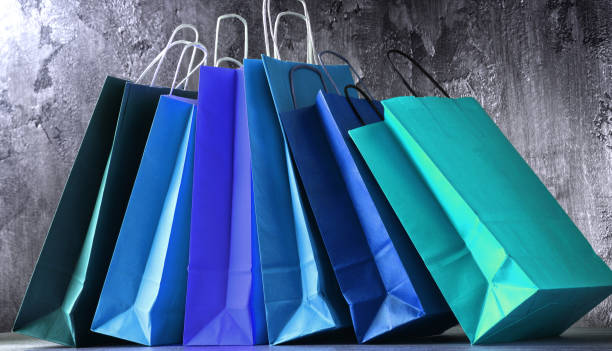 istock Composition with colorful paper shopping bags 947768492