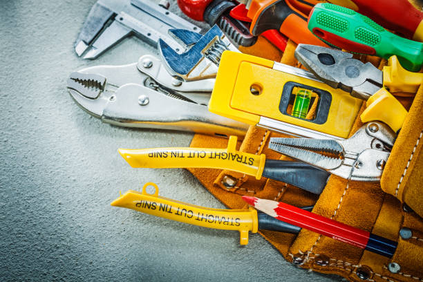 istock Set of construction tooling in tool belt on concrete background 947777282