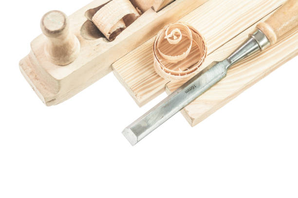 istock Wooden planks chisel shavings planer isolated on white 947777852
