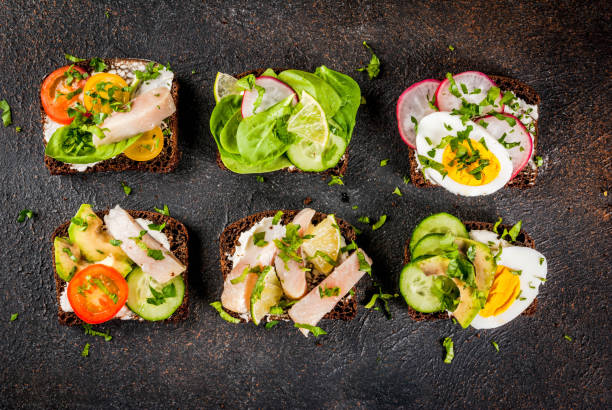dänische sandwiches smorrebrod - sandwich avocado prepared shrimp bread stock-fotos und bilder