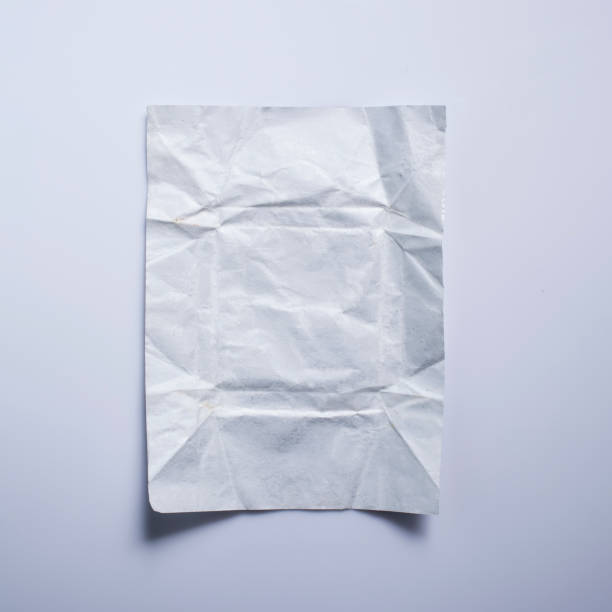 istock Crumpled white paper, Wrinkled white paper isolated on white background 947781320