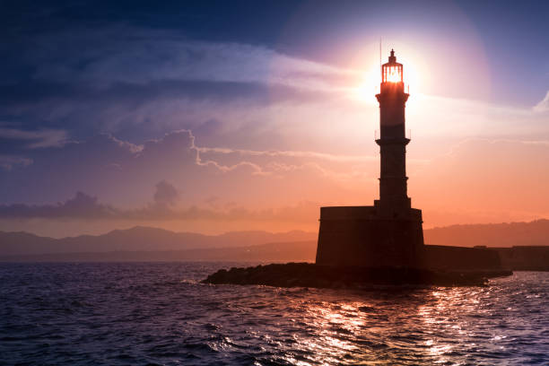 istock A beautiful night sky behind a shining lighthouse. Crete, Greece 947783444