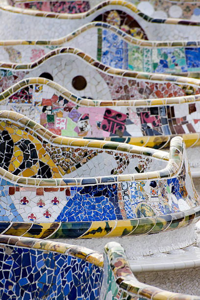 Parc Guell Bench, Artistic Architecture by Antoni Gaudì in Barcelona The world-famous bench of the Parc Guell designed and built by the spanish architect Antoni Gaudi in 1900-1914. The location is Barcelona, Spain. antoni gaudí stock pictures, royalty-free photos & images