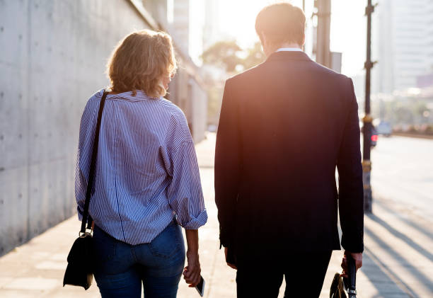 istock Couple walking on the pavement 947803238