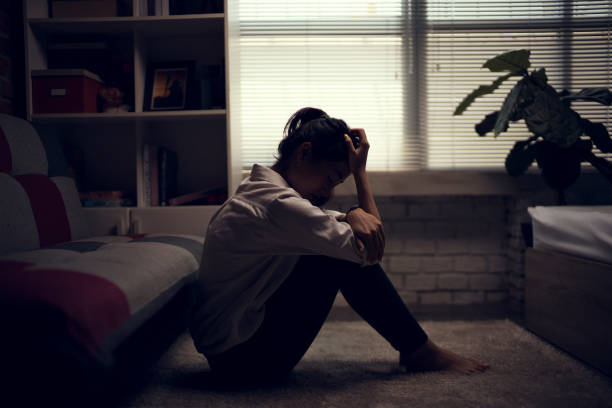 Business woman is depressed. She felt stressed and alone in the house. Business woman is depressed. She felt stressed and alone in the house. depression sadness stock pictures, royalty-free photos & images