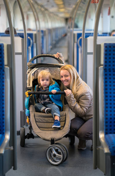 istock Young happy mother and son traveling by train. 947811242