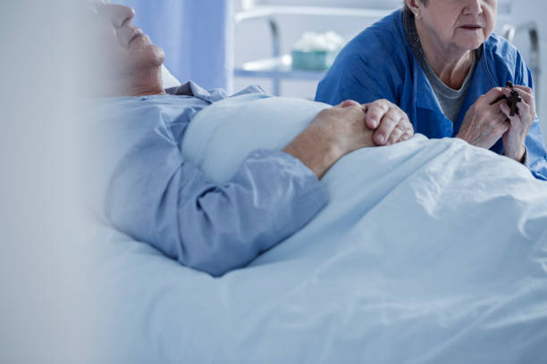 istock Patient in a coma and wife 947826232