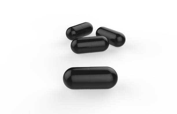 istock Black pills on isolated white background, 3d illustration 947827386