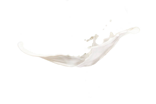 istock Still of milk/white liquid mid-splash on white background 947836080