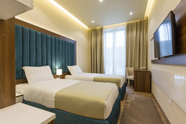istock Interior of a double bed hotel bedroom 947836764