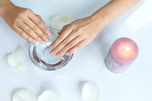 istock Manicure. Female Hands With Perfect Fingernails Soaking In Water 947837822
