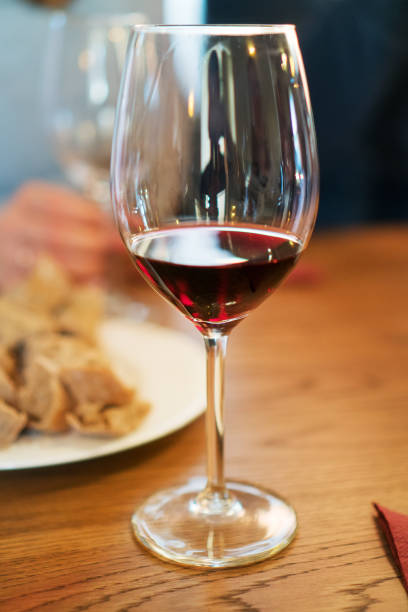istock Glass of red wine is on the table. Wine degustation. 947843336