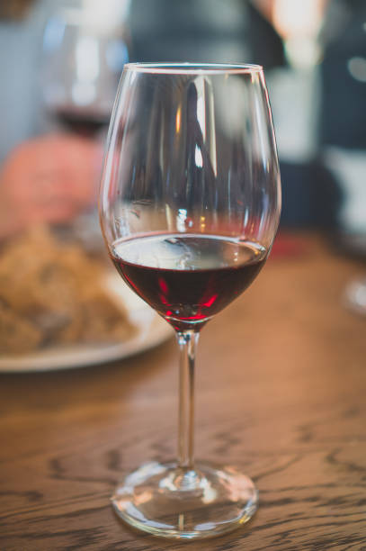 istock Glass of red wine is on the table. Wine degustation. 947843426