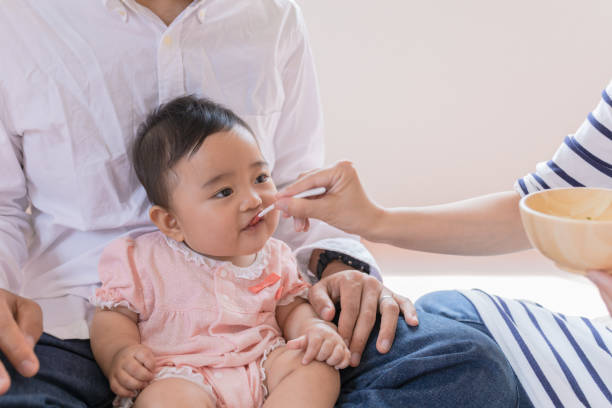 istock Baby eating baby food 947843812