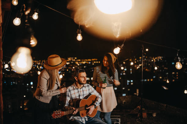 Friends drinking and partying on the rooftop