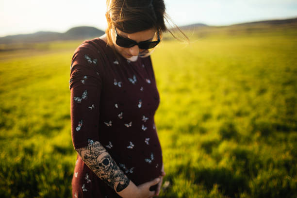 Young, modern woman enjoying in pregnancy and nature