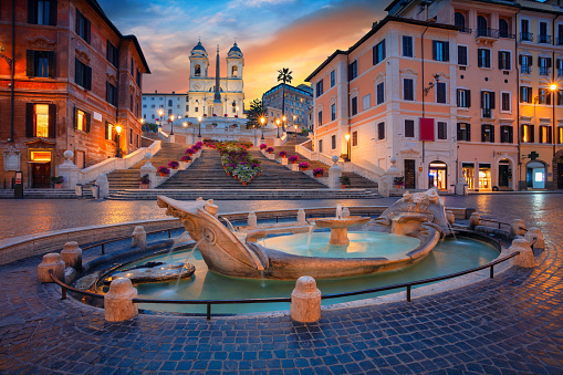 Piazza Navona in Rome Italy, crowded with tourists, on a winter day, just before sunset. In the foreground the famous Fontana del Moro.